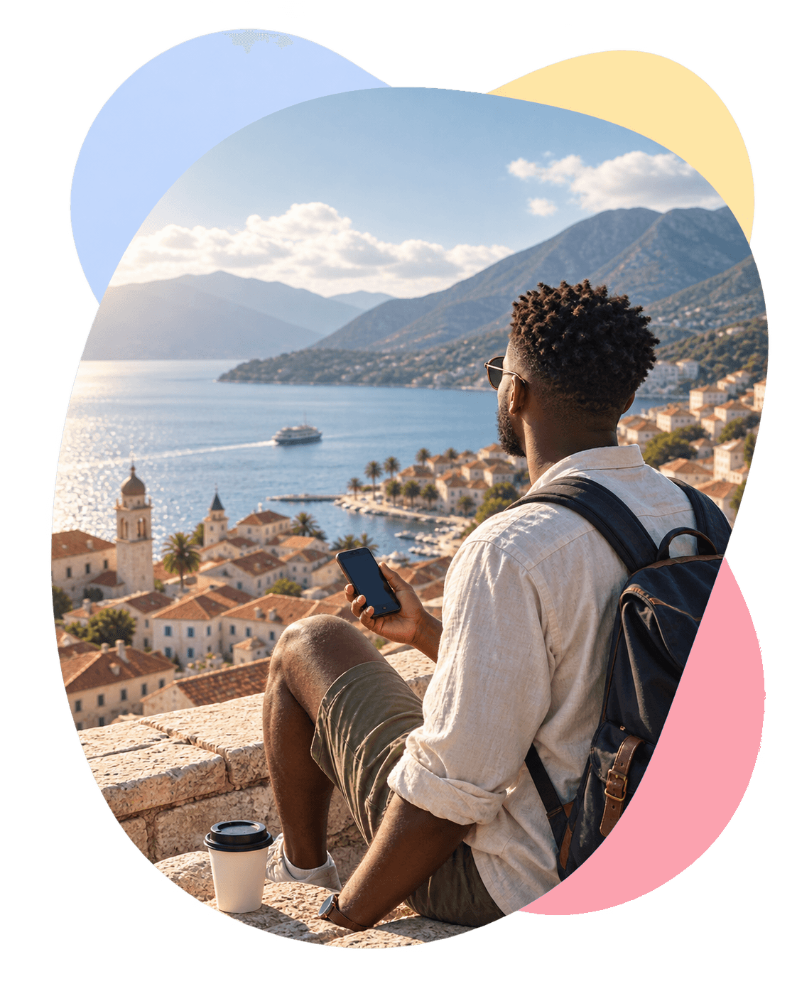 A traveler checking his phone above a coastal town