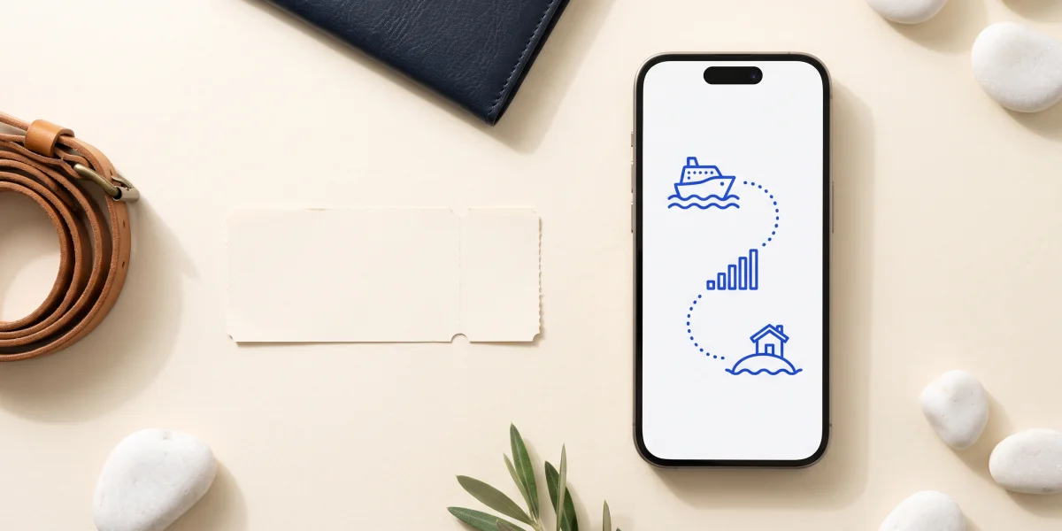 A phone showing a ferry, signal bars and a small island joined by a dotted line, beside a blank ferry ticket, a coiled leather strap and white sea pebbles